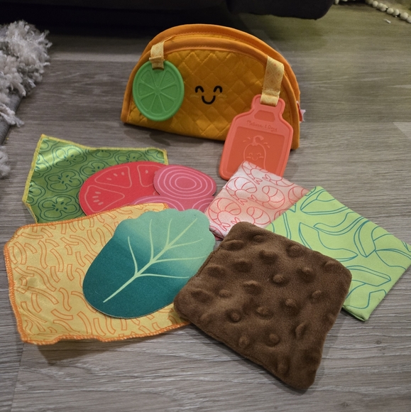 Melissa & Doug Multi-Sensory Soft Taco Fill & Spill Infant Toy - Picture 1 of 2